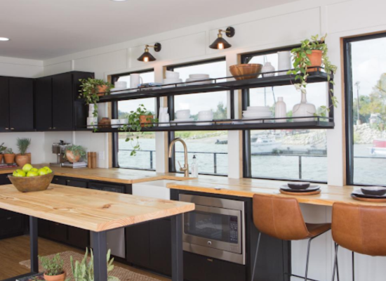 Black cabinets with natural lighting in kitchen